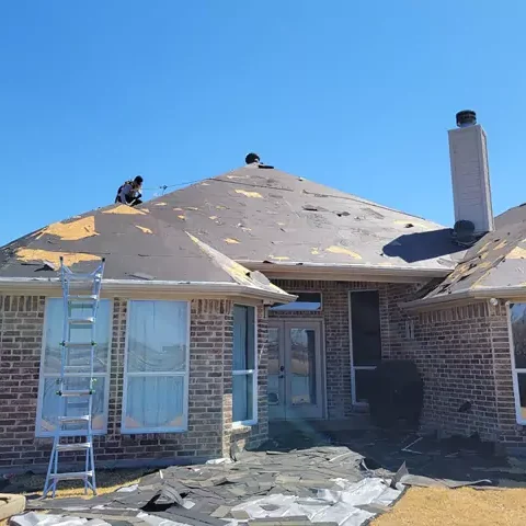 Home getting a new roof and shingles being removed also before trim repainted