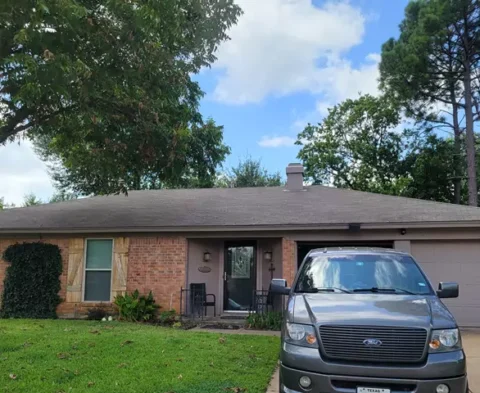 Before photo old roof and before repainting trim and shutters