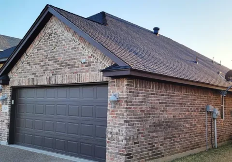 After new roof along with trim and garage door painted