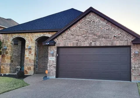 After new roof along with trim and garage door painted